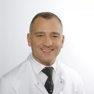 Dr. med. Adrian Komadinic